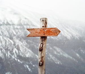 Arrow pointing in mountains to signify new direction for you.